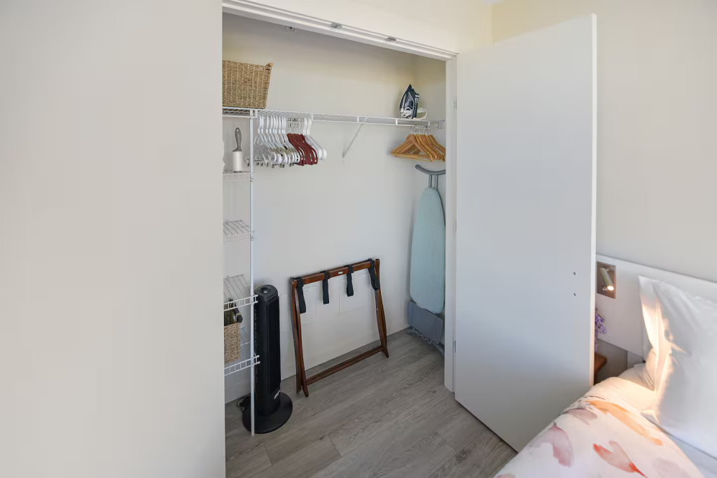 Loads of storage in this bedroom closet, ample room for hanging your clothes!