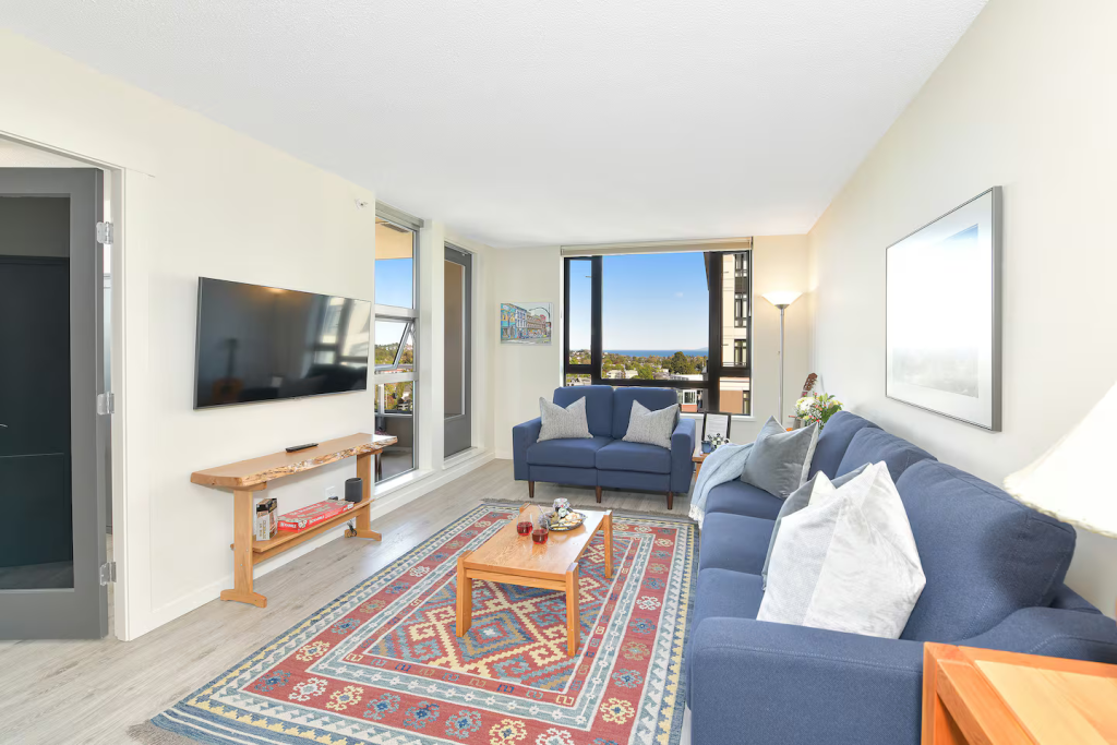 Comfortable and bright living room with 50" wall mounted Smart TV